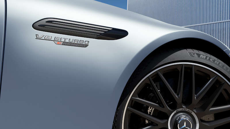 A front fender view of the badge and tire on the 2026 Mercedes-AMG® SL 63 S E PERFORMANCE Roadster