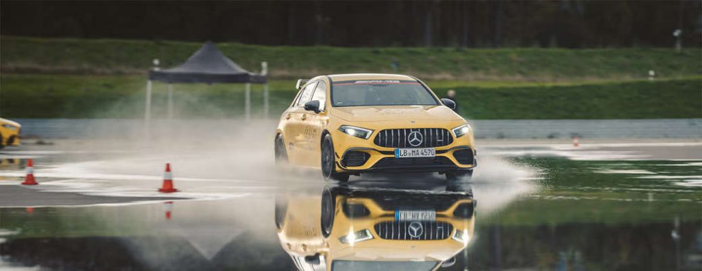 An AMG® vehicle making use of Track Pace 2.0 on a specialized wet track.