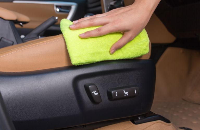 Man cleaning car's interior