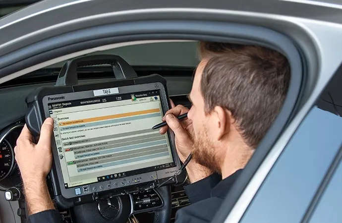 A Mercedes-Benz service technician going over the Service A checklist at Mercedes-Benz of Scottsdale near Phoenix, AZ