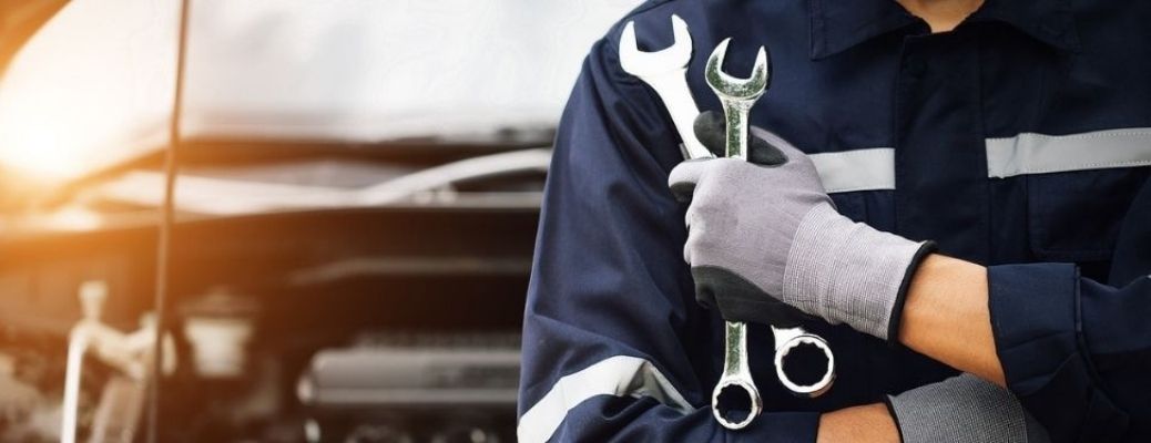 Service technician holding tools