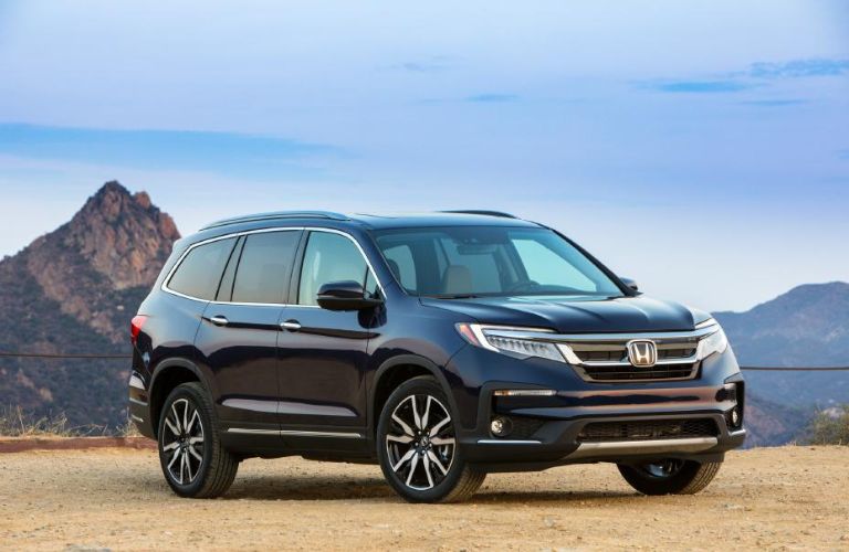 A 2021 Honda Pilot on a sandy terrain