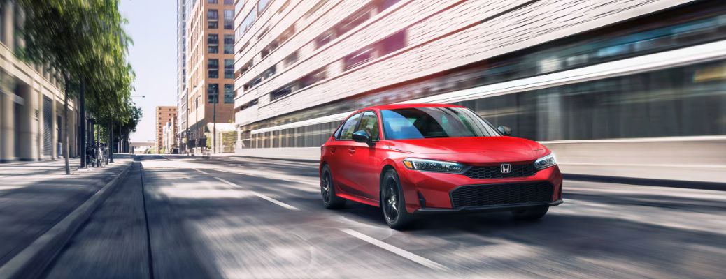 2026 Honda Civic Sedan Red on the road