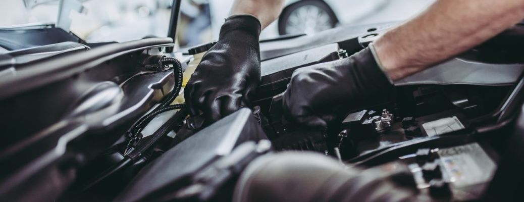 representative image of a technician inspecting a vehicle