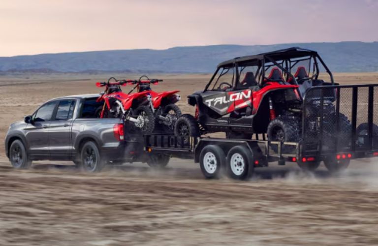 rear view of the 2026 Honda Ridgeline towing bikes