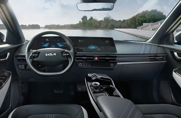 The steering wheel of the Kia car is shown.