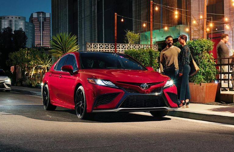 One red color Toyota Camry is parked.