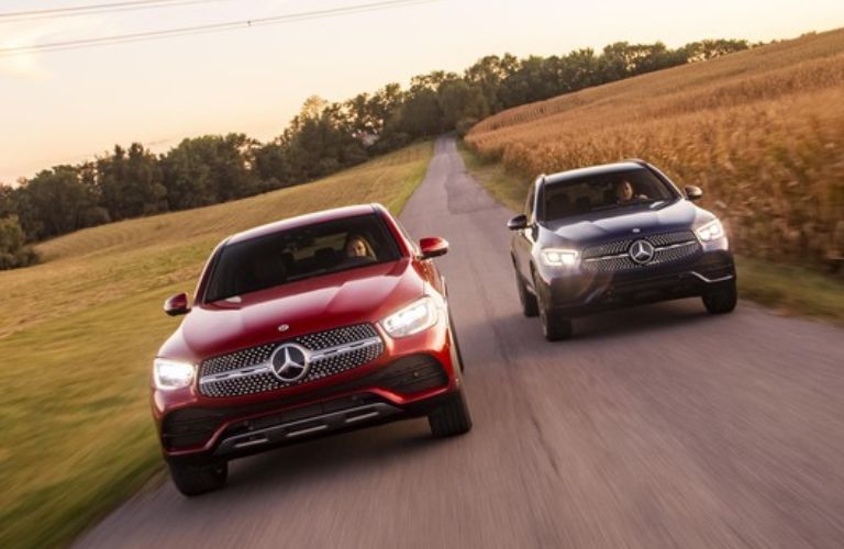 Two 2022 Mercedes-Benz GLC SUV driving side by side