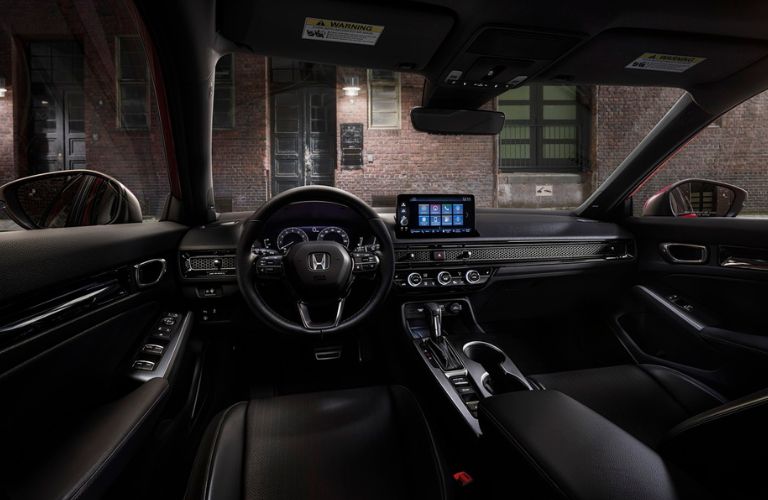 The steering wheel area of the 2022 Honda Civic is shown.