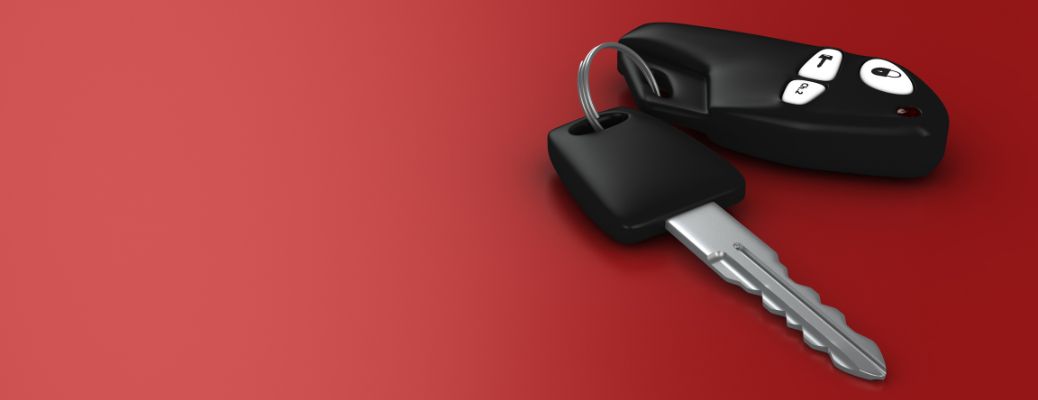 car key fob on red background