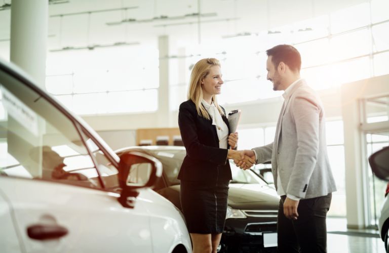 sales representative shaking hands with a client