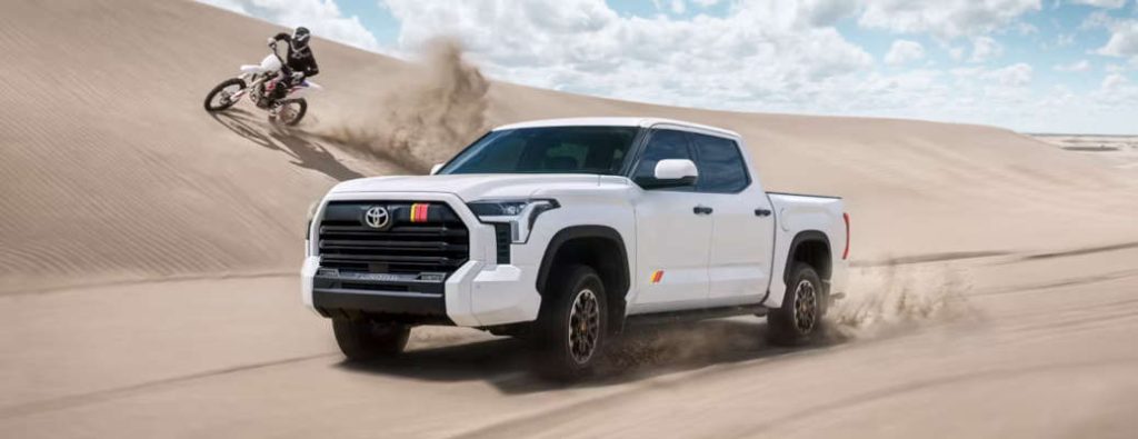 The 2026 Toyota Tundra showing the off-road advantages of AWD vs 4WD