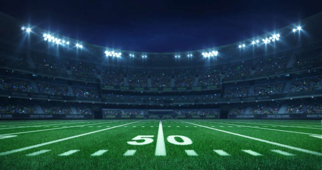 The fifty yard line at a football game, which could be the reader at the Super Bowl 