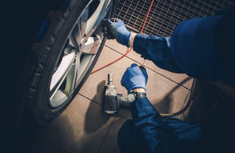 Mechanic inspecting a tire