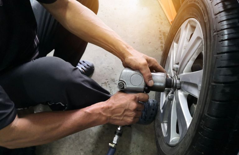 Technician fixing a tire