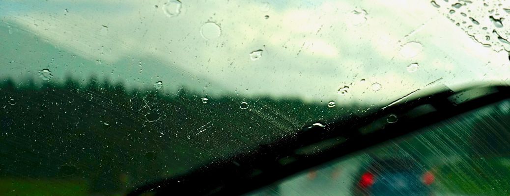representative image of a windshield with raindrops
