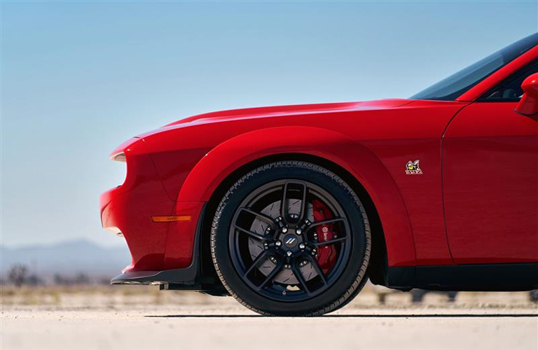 Front wheel of the 2019 Dodge Challenger model parked at sunset