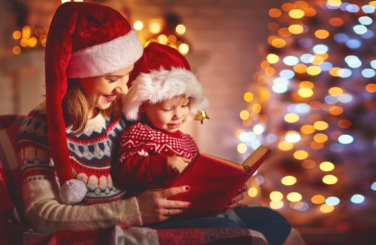 Mother and child near a decorated Christmas Tree 