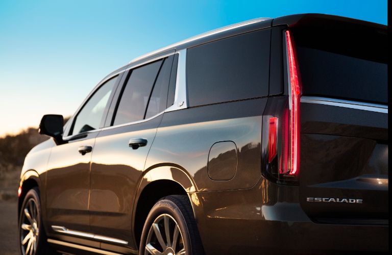 2021 Cadillac Escalade exterior rear shot closeup of trunk and taillight design as the sun glares