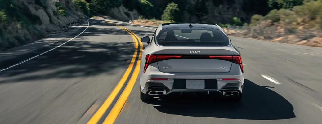 2026 Kia K5 rear view on a road