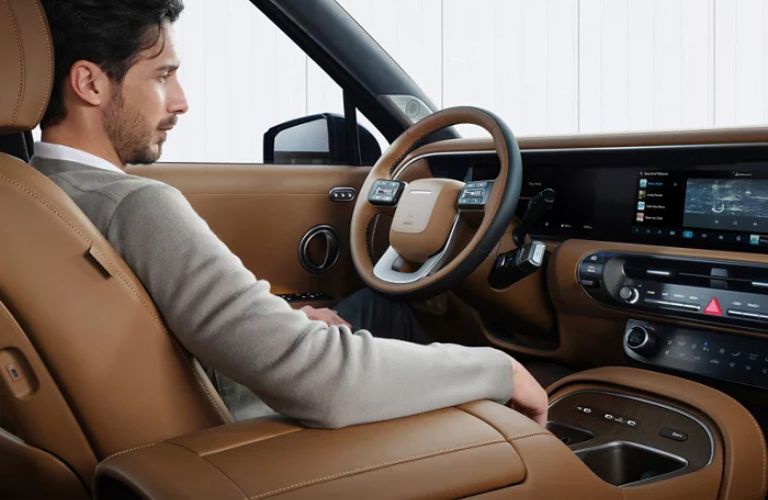 2026 Hyundai Palisade with a driver in the driver's seat