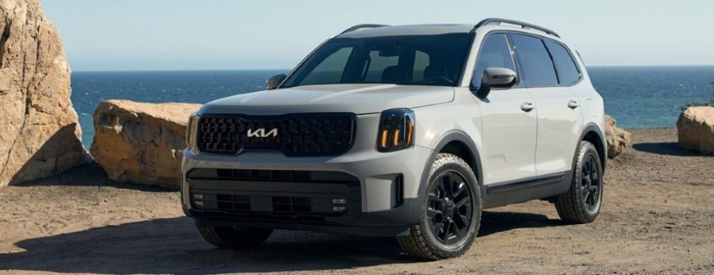 2025 Kia Telluride front and side view in front of water