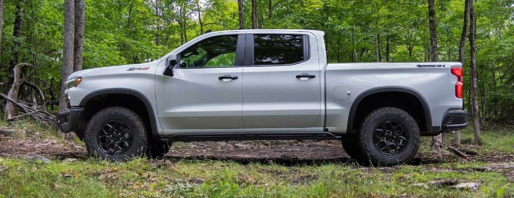 2023 Chevrolet Silverado truck side view in the woods