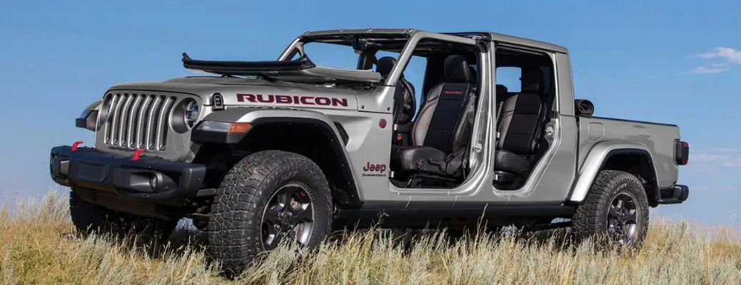 A 2023 Jeep Gladiator on a grassy terrain