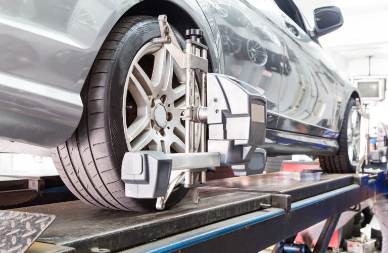 Vehicle in a auto repair shop for tire alignment