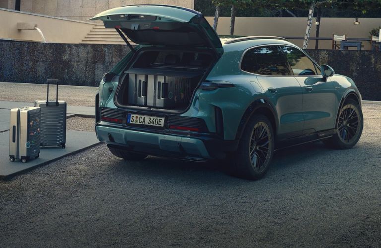 cargo area of the Cayenne Electric filled with luggage