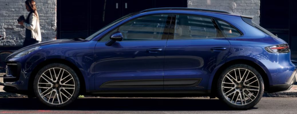 Side view of the 2026 Porsche Macan Blue parked