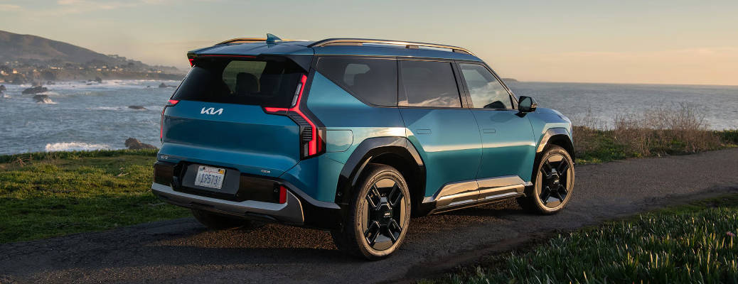 A rear quarter exterior view of the 2026 Kia EV9