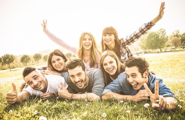 a group of people lying at a park