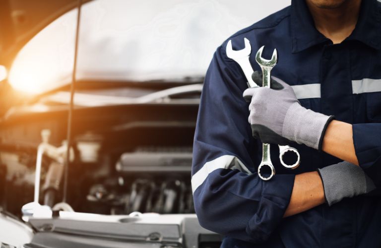 a technician holding tools