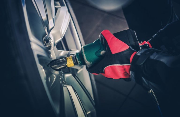 close up of a technician repairing a tire