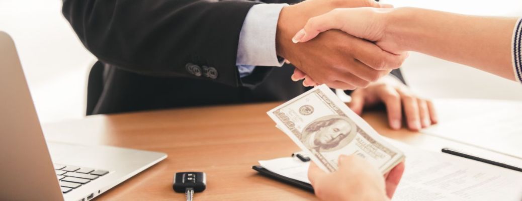 close up of two people shaking hands