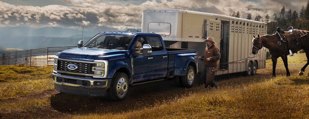 A 2026 Ford F-Series diesel pickup truck towing a large horse trailer