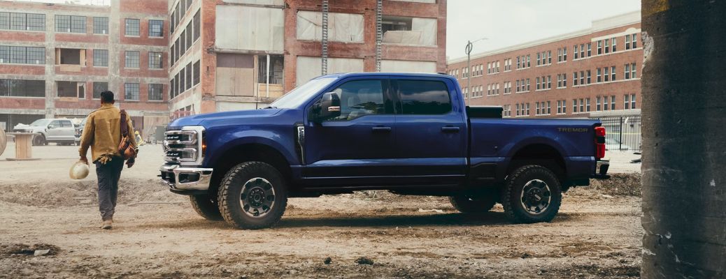 Roofing contractor walking towards his work site with the Ford F-250 in the foreground