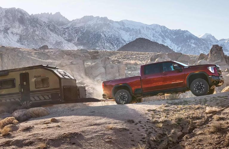 side view of the GMC Sierra 3500HD towing a trailer
