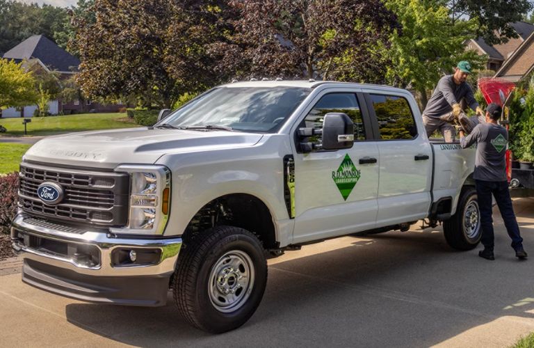 Landscapers loading material into the Ford Super Duty®