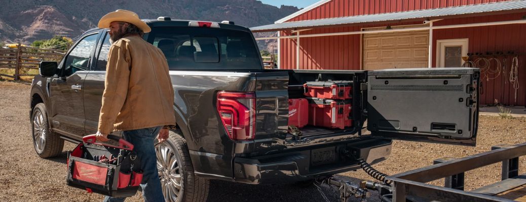 Securely placed construction material in the Ford F-150® with a construction worker in the foreground
