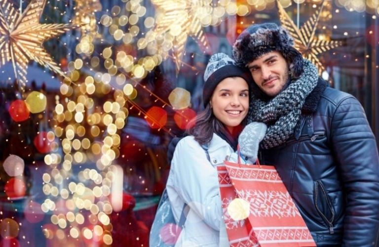 Happy couple Christmas shopping together