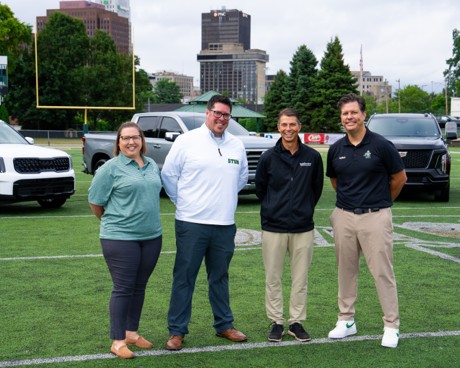 Four community members and Vandevere Kia employees