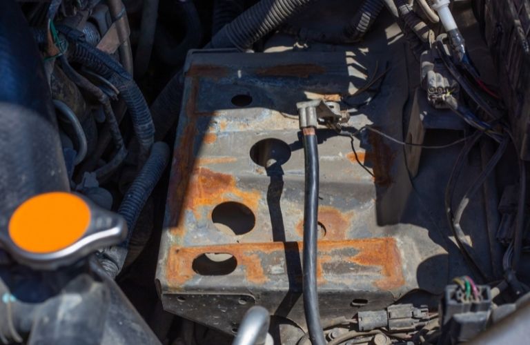 The corroded battery case of a vehicle