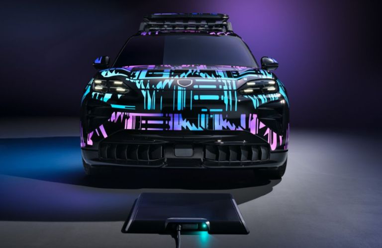 A Porsche wireless charging and a Porsche Cayenne vehicle exterior front view