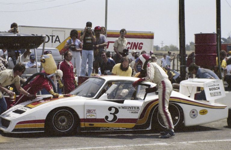 People surrounding the Porsche 935-L