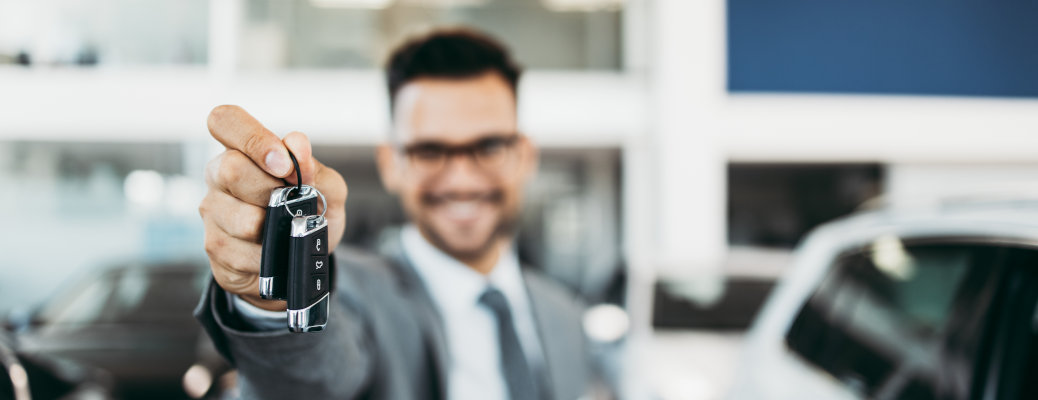 A man showing car keys