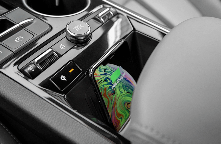 a phone charging inside the Kia K5