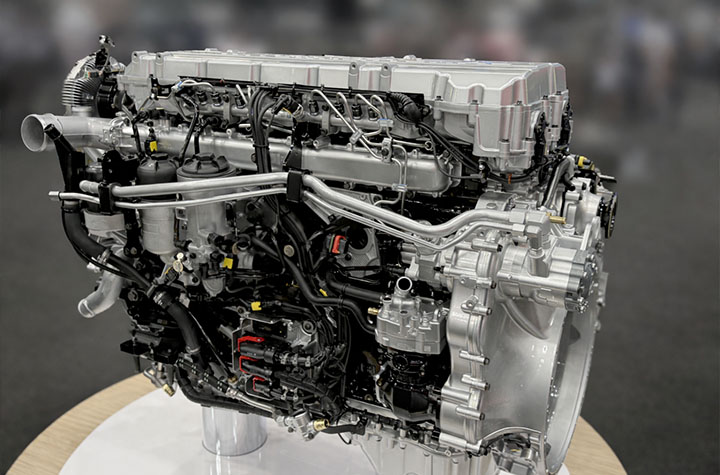 2027 Emissions Changes, silver engine showing components in detail on display
