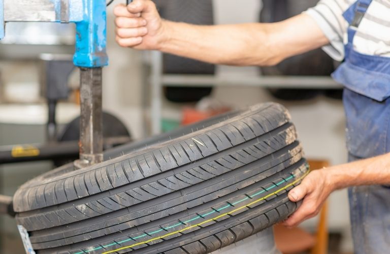 Rotating a tire of a vehicle